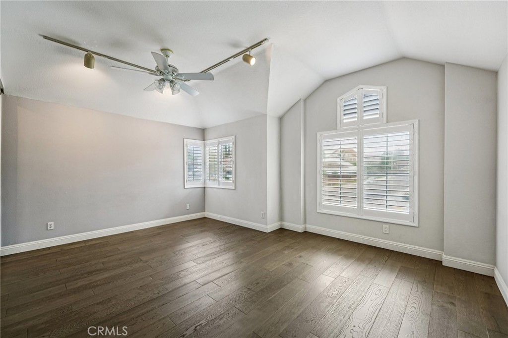 901 Clearwood Avenue Riverside, CA 92506 - Photo 17 of 36 a view of an empty room with wooden floor and a window