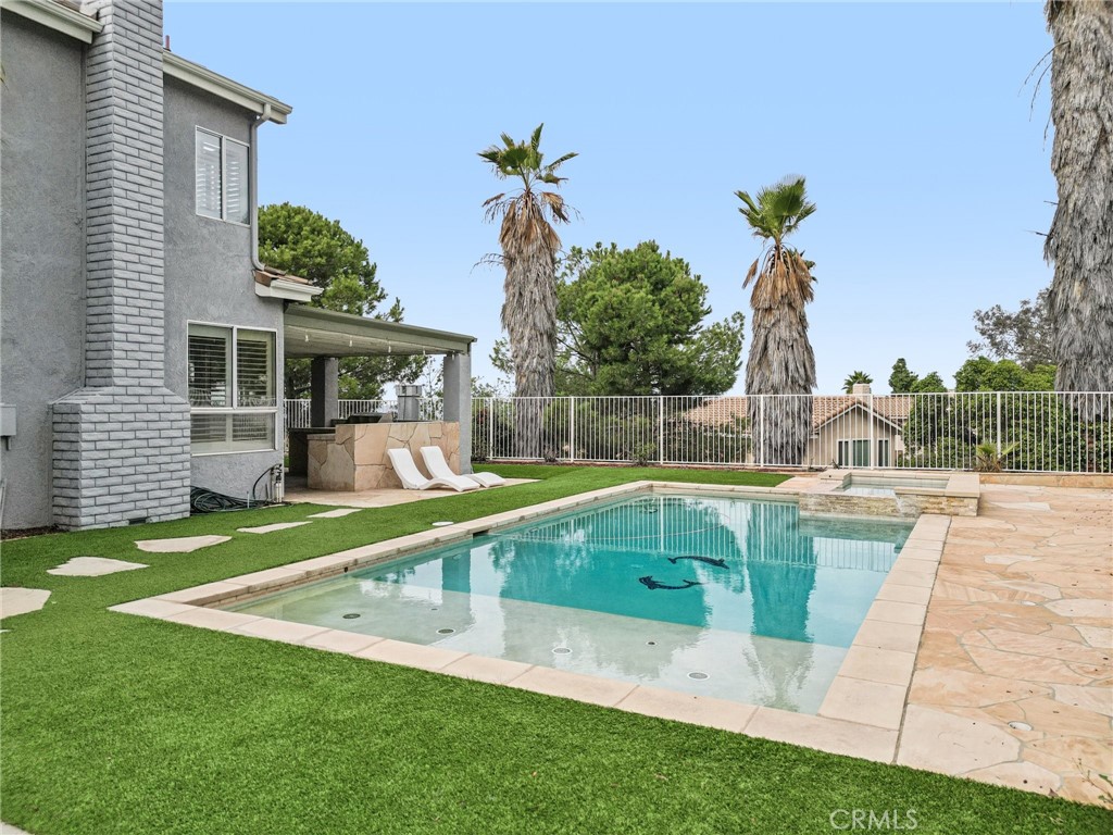 901 Clearwood Avenue Riverside, CA 92506 - Photo 22 of 36 a view of a house with a backyard