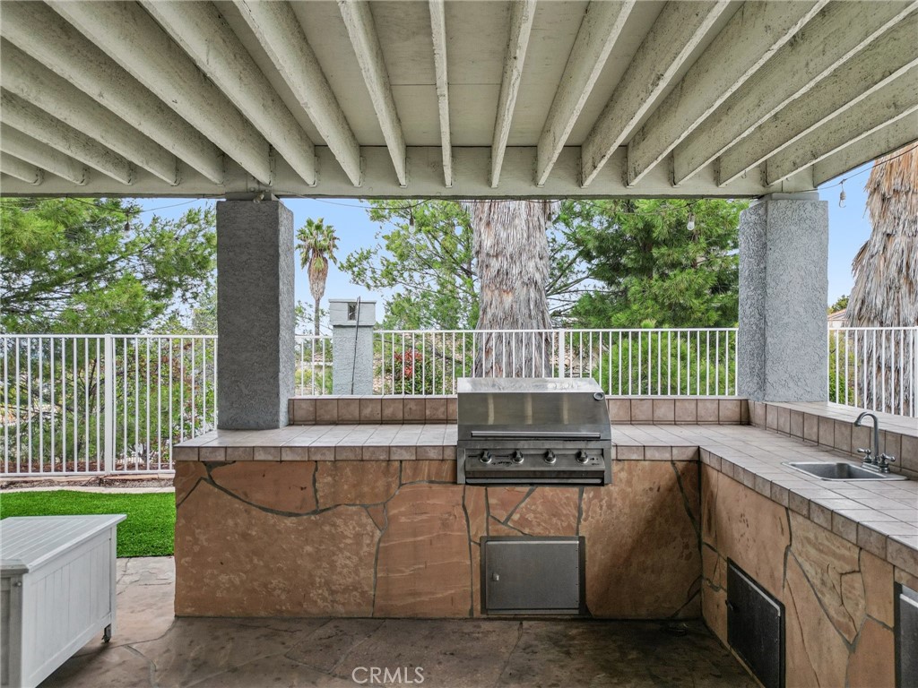 901 Clearwood Avenue Riverside, CA 92506 - Photo 23 of 36 a living room with furniture and a garden