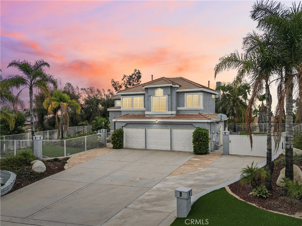 901 Clearwood Avenue Riverside, CA 92506 - Photo 30 of 36 a front view of a house with a garden and trees