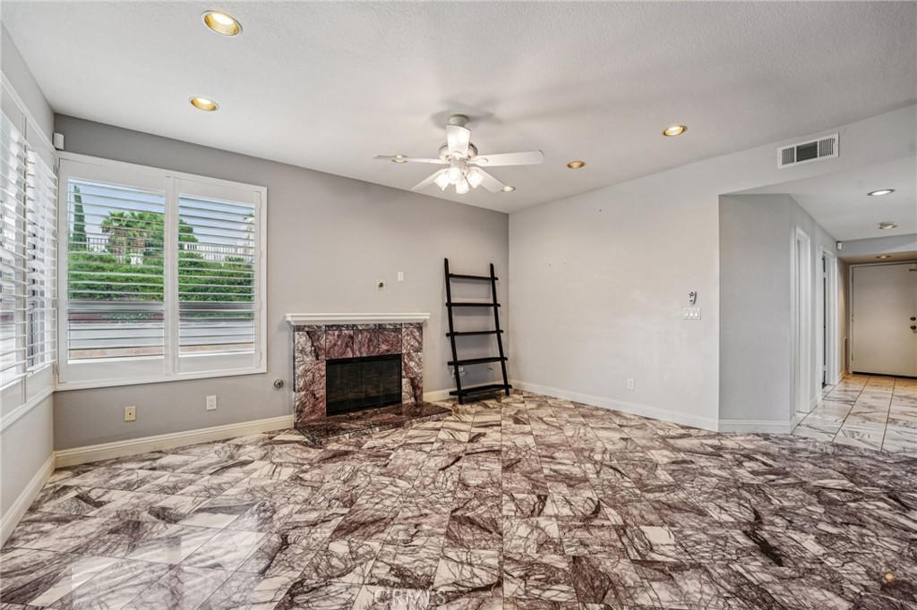 901 Clearwood Avenue Riverside, CA 92506 - Photo 8 of 36 a view of a livingroom with a fireplace window and a fireplace