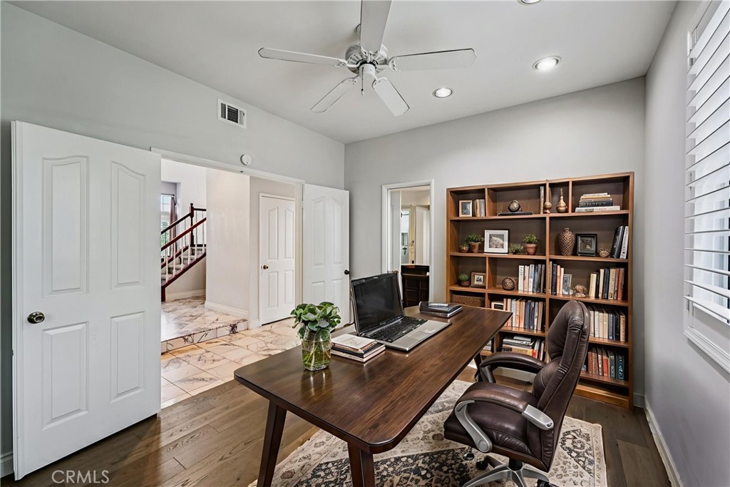901 Clearwood Avenue Riverside, CA 92506 - Photo 10 of 36 a workspace with a bookshelf and a window