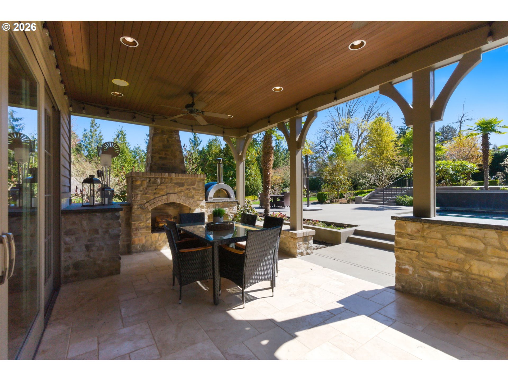 951 Atwater Road Lake Oswego, OR 97034 - Photo 18 of 46 a living room with patio furniture and a floor to ceiling window