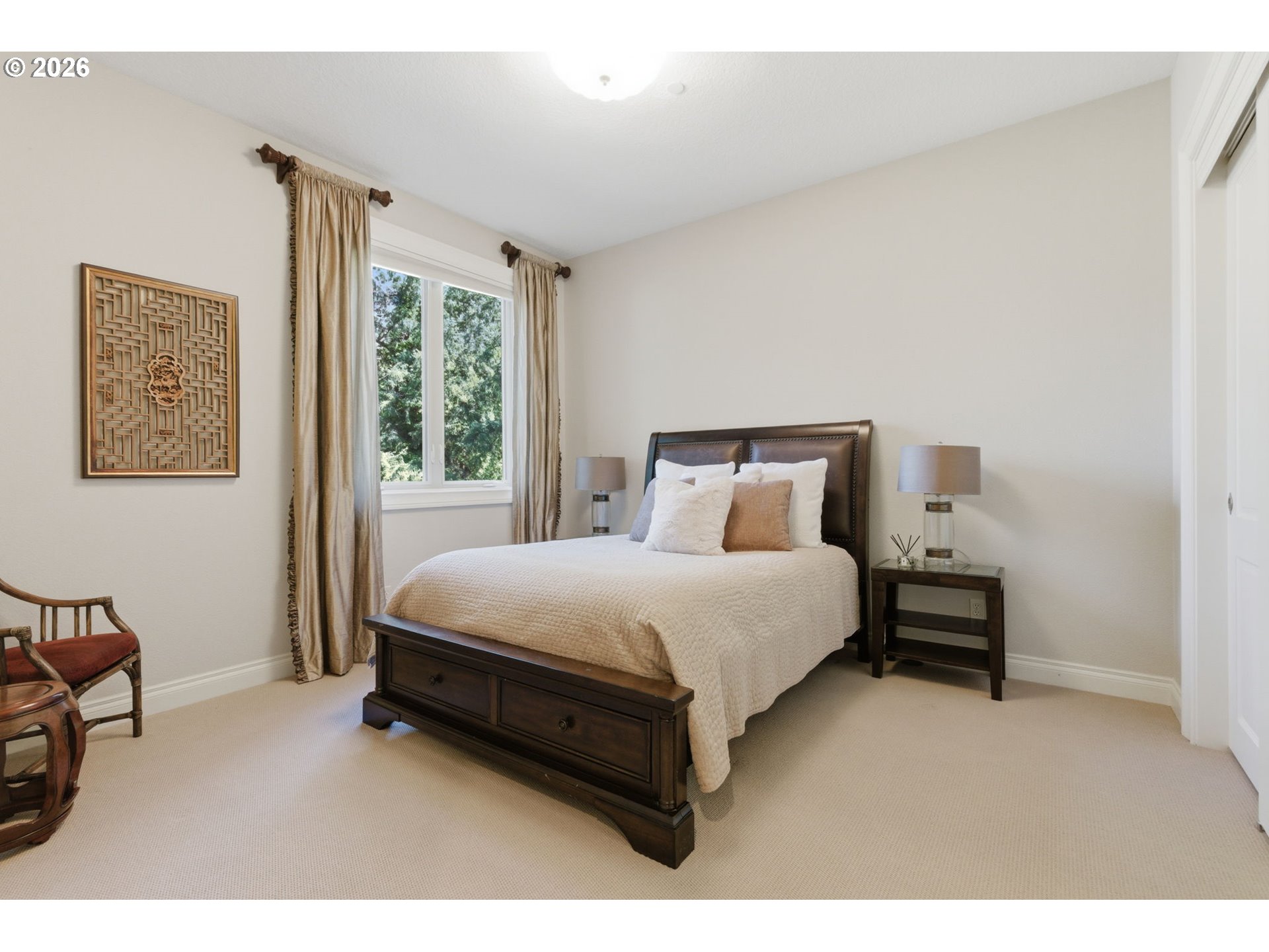 951 Atwater Road Lake Oswego, OR 97034 - Photo 28 of 46 a bed sitting in a bedroom next to a window