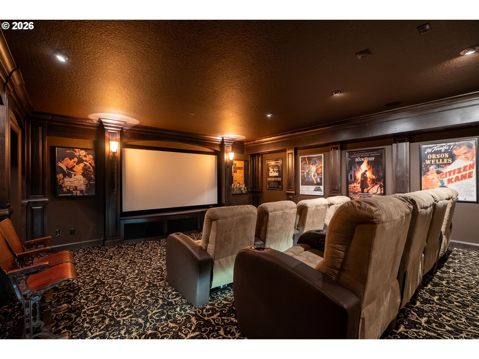 951 Atwater Road Lake Oswego, OR 97034 - Photo 32 of 46 a media room with lots of chairs and a projector screen