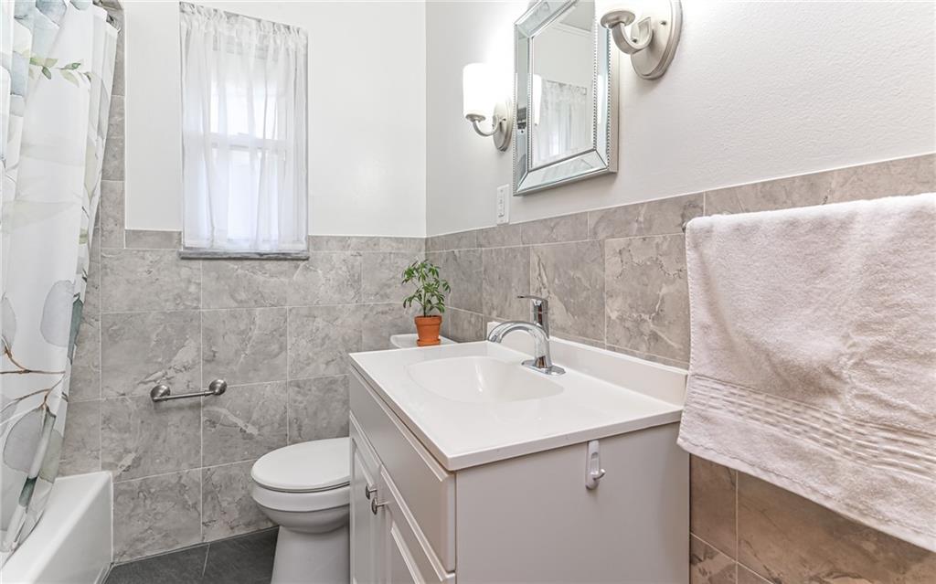 160 Siebert Road Pittsburgh, PA 15237 - Photo 17 of 31 a bathroom with a sink a toilet and mirror
