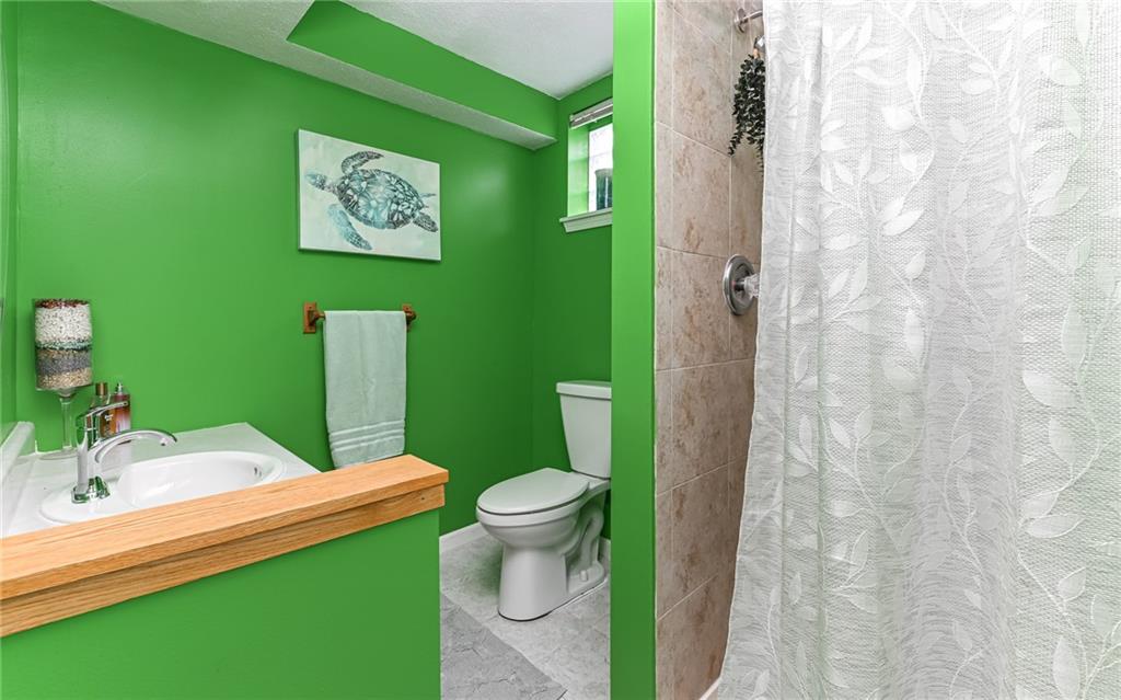 160 Siebert Road Pittsburgh, PA 15237 - Photo 21 of 31 a bathroom with a toilet sink and mirror