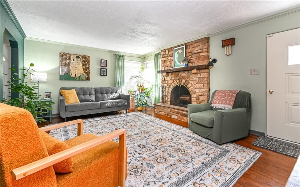 160 Siebert Road Pittsburgh, PA 15237 - Photo 4 of 31 a living room with furniture and a fireplace