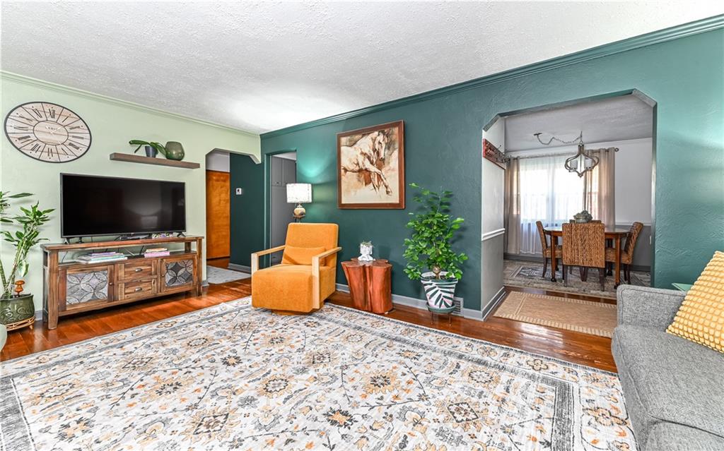 160 Siebert Road Pittsburgh, PA 15237 - Photo 6 of 31 a living room with furniture and a flat screen tv