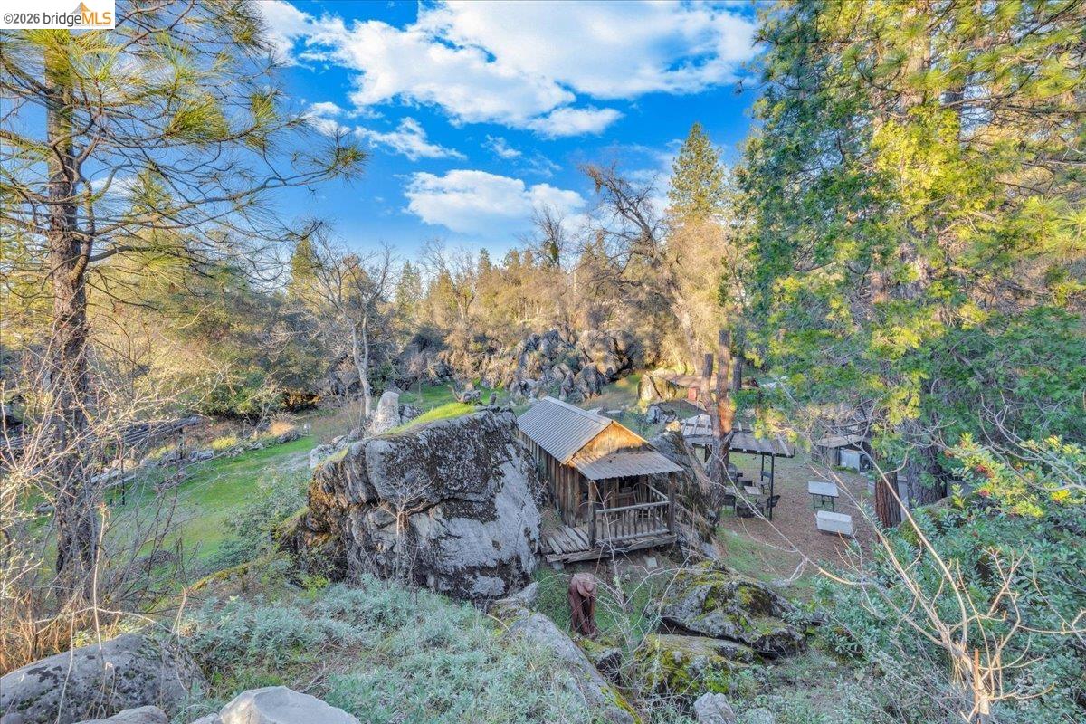 22389 Parrotts Ferry Road Columbia, CA 95310 - Photo 10 of 60 View of yard with a wooden deck