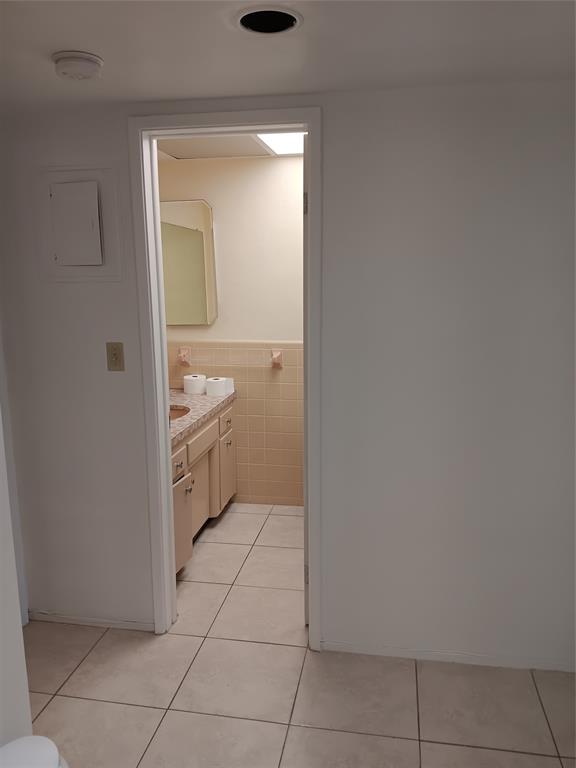 1110 North Riverside Drive, Unit 26 Pompano Beach, FL 33062 - Photo 12 of 17 a bathroom with a granite countertop sink and a mirror