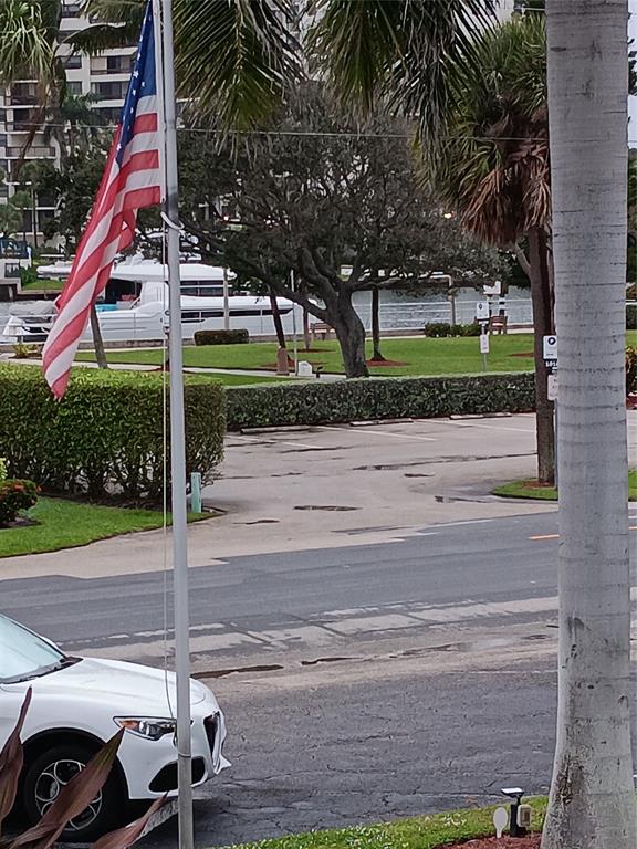 1110 North Riverside Drive, Unit 26 Pompano Beach, FL 33062 - Photo 15 of 17 a front view of a house with garden
