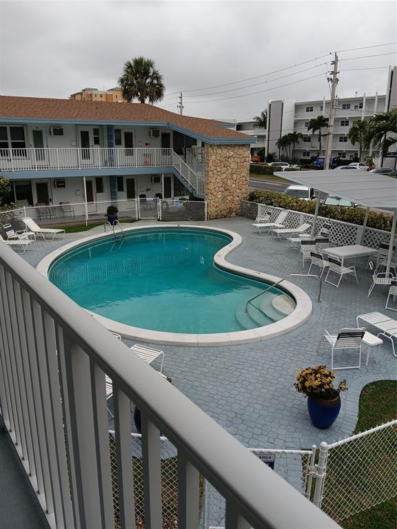 1110 North Riverside Drive, Unit 26 Pompano Beach, FL 33062 - Photo 16 of 17 a view of a house with swimming pool and sitting area