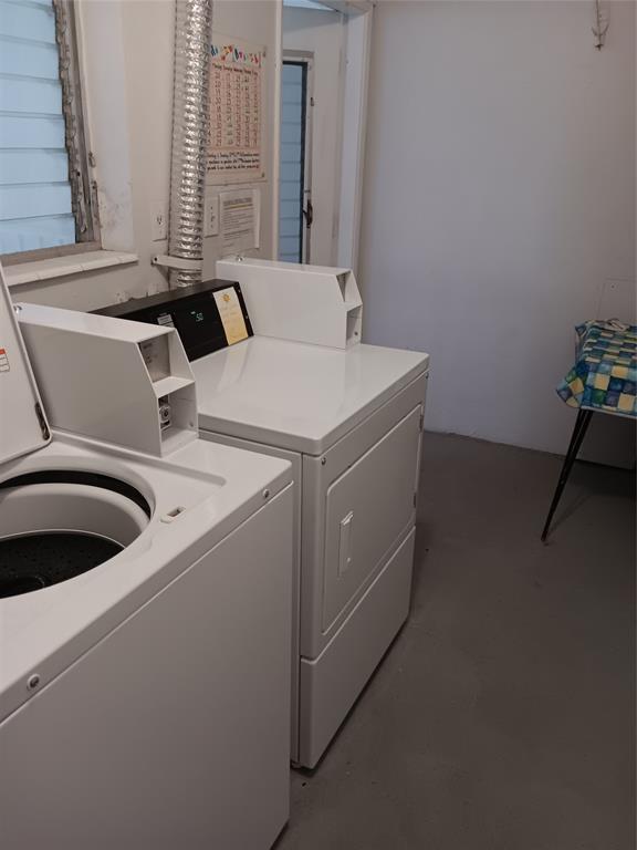1110 North Riverside Drive, Unit 26 Pompano Beach, FL 33062 - Photo 17 of 17 a utility room with dryer and washer