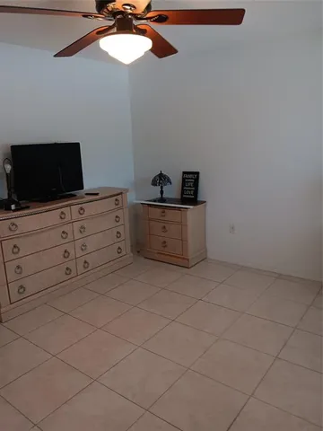 a room with cabinets and flat screen tv
