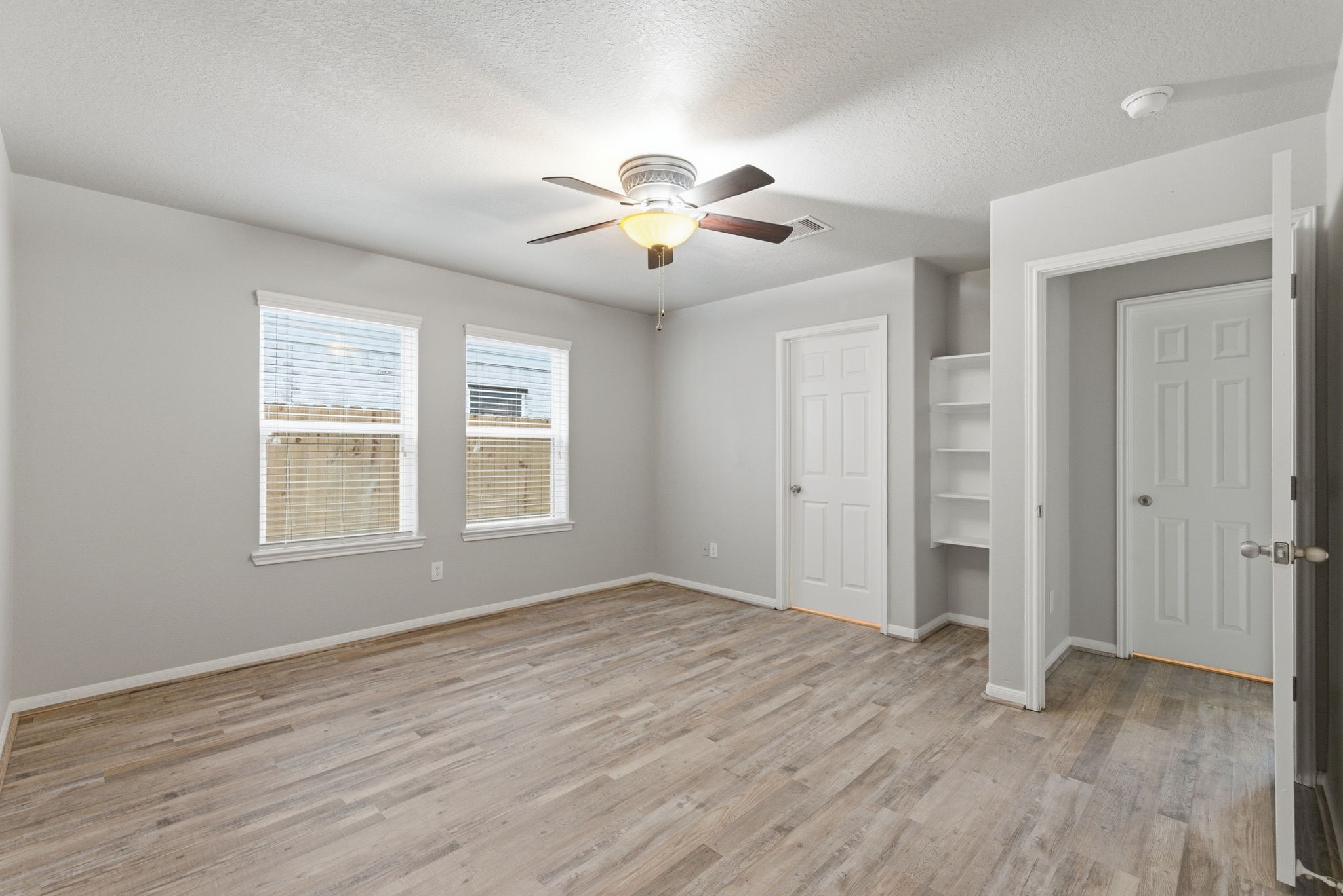 4910 Conifer Ridge Way Humble, TX 77346 - Photo 22 of 48 wooden floor in an empty room with a window