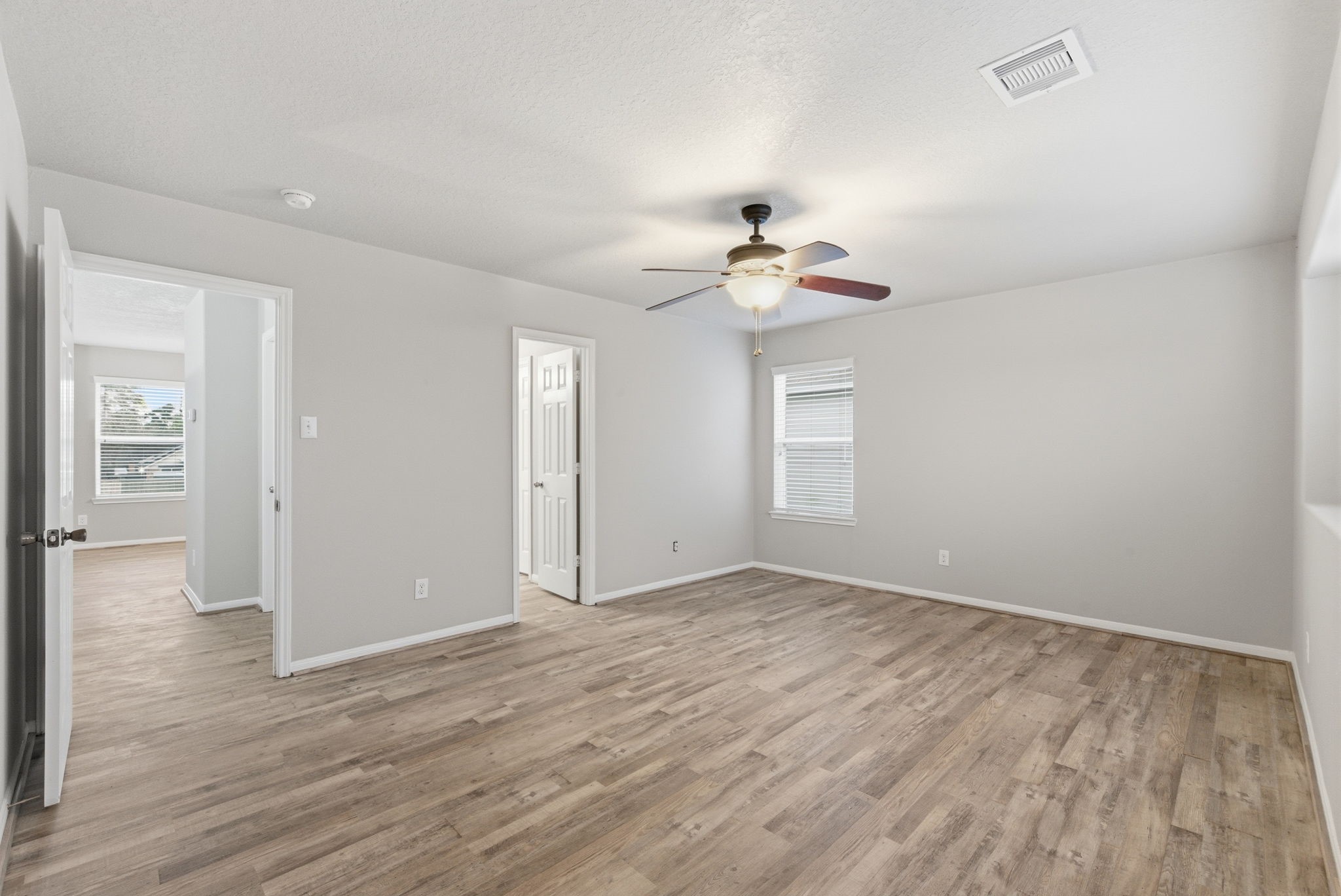 4910 Conifer Ridge Way Humble, TX 77346 - Photo 35 of 48 a view of an empty room with wooden floor