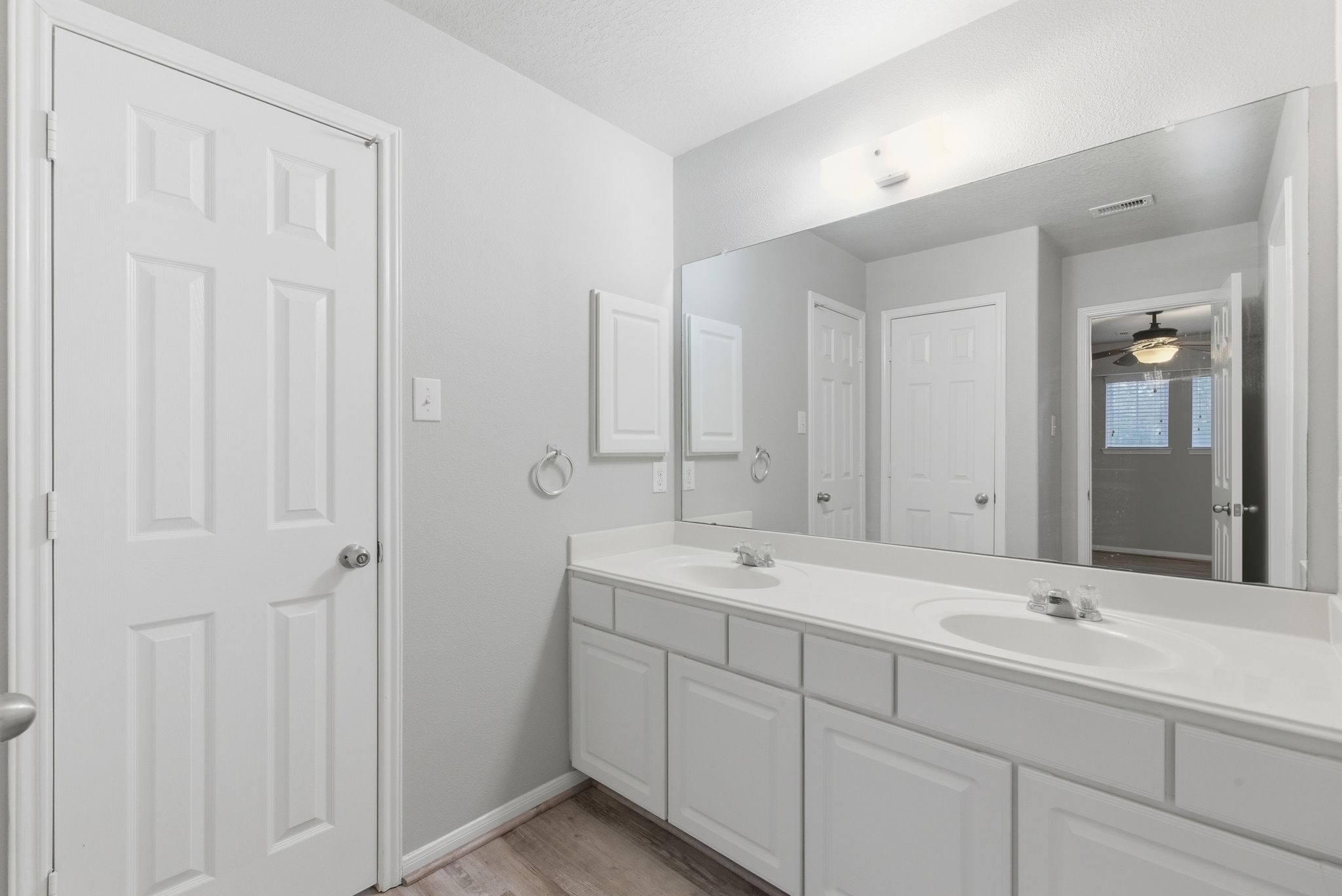 4910 Conifer Ridge Way Humble, TX 77346 - Photo 37 of 48 a bathroom with a double vanity sink and mirror