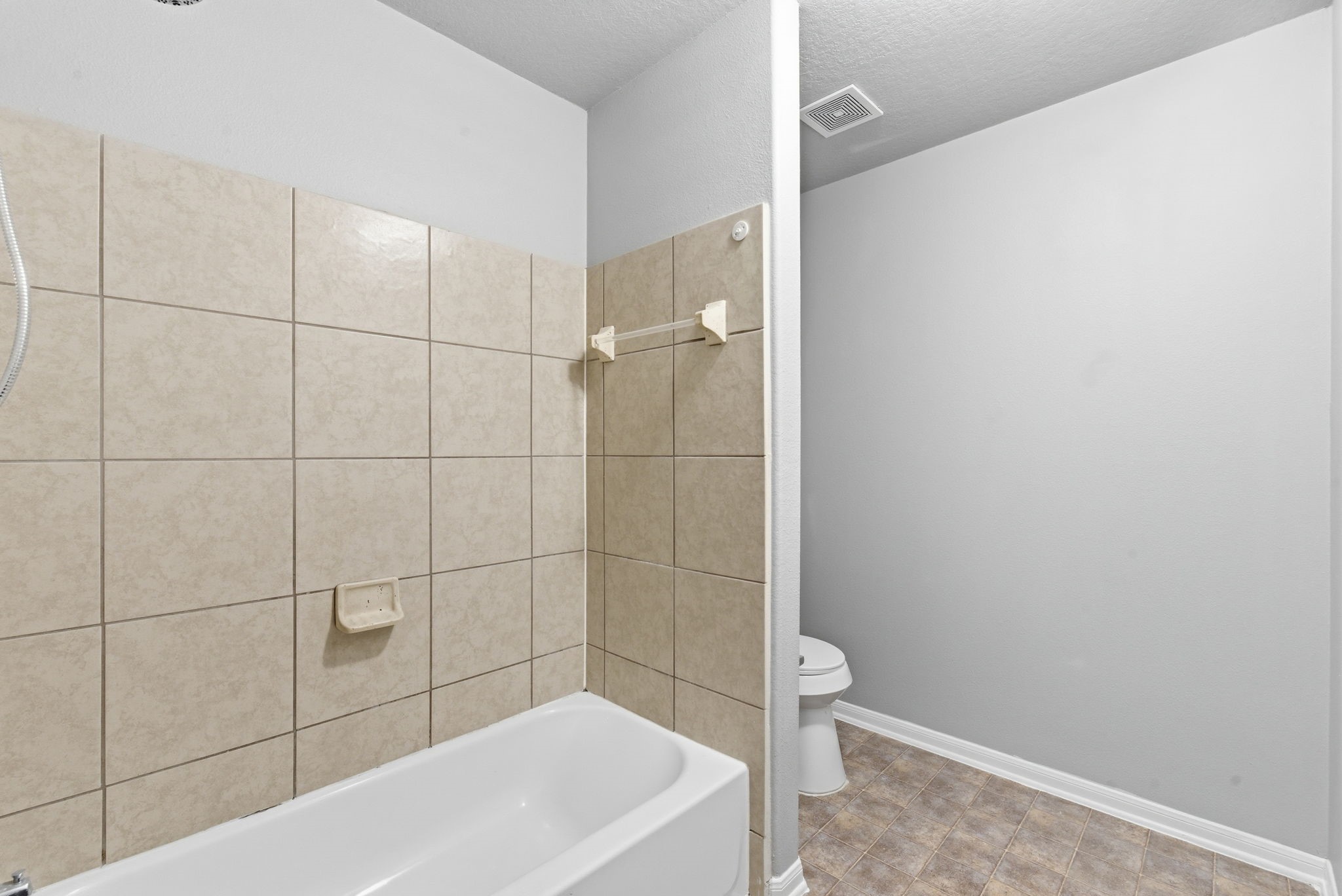 4910 Conifer Ridge Way Humble, TX 77346 - Photo 38 of 48 a bathroom with a bathtub and shower