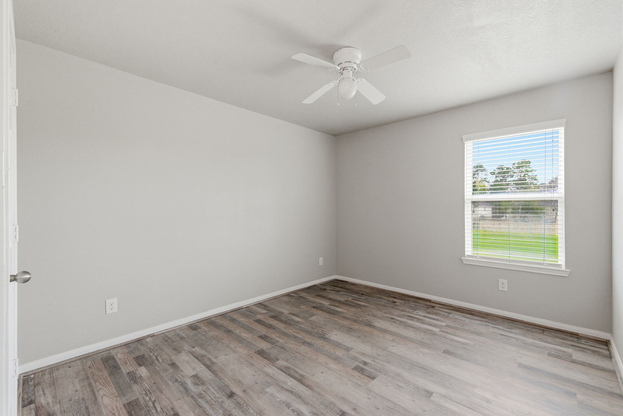 4910 Conifer Ridge Way Humble, TX 77346 - Photo 41 of 48 an empty room with wooden floor and windows