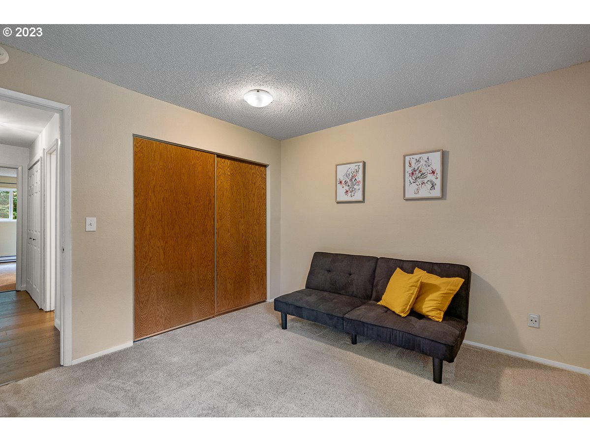 4308 Southwest Dickinson Street, Unit 15 Portland, OR 97219 - Photo 15 of 35 a living room with furniture and a air conditioner vent