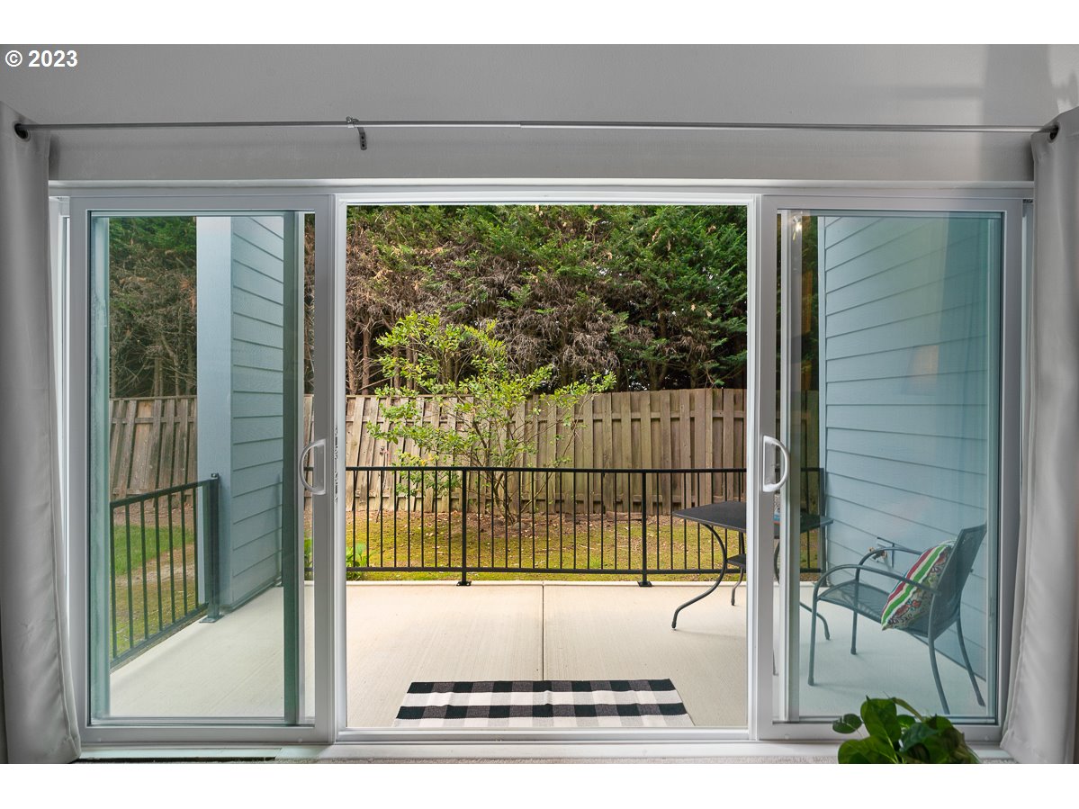 4308 Southwest Dickinson Street, Unit 15 Portland, OR 97219 - Photo 21 of 35 a view of a building from a living room