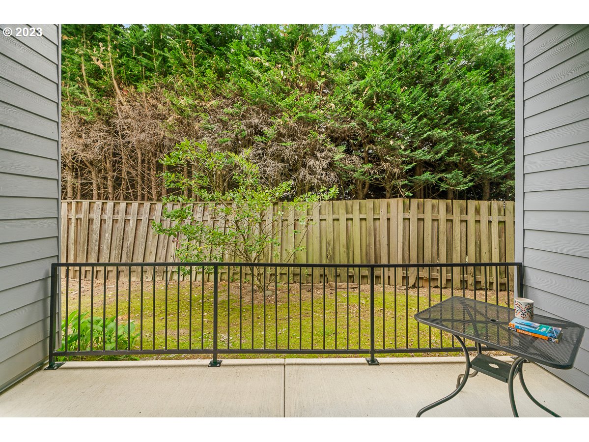 4308 Southwest Dickinson Street, Unit 15 Portland, OR 97219 - Photo 22 of 35 a view of a chair and table