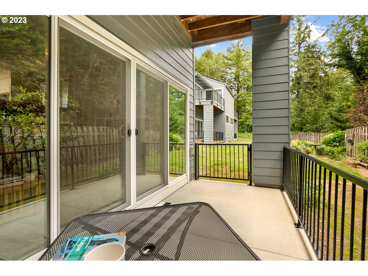 4308 Southwest Dickinson Street, Unit 15 Portland, OR 97219 - Photo 24 of 35 a view of a balcony with a floor to ceiling window