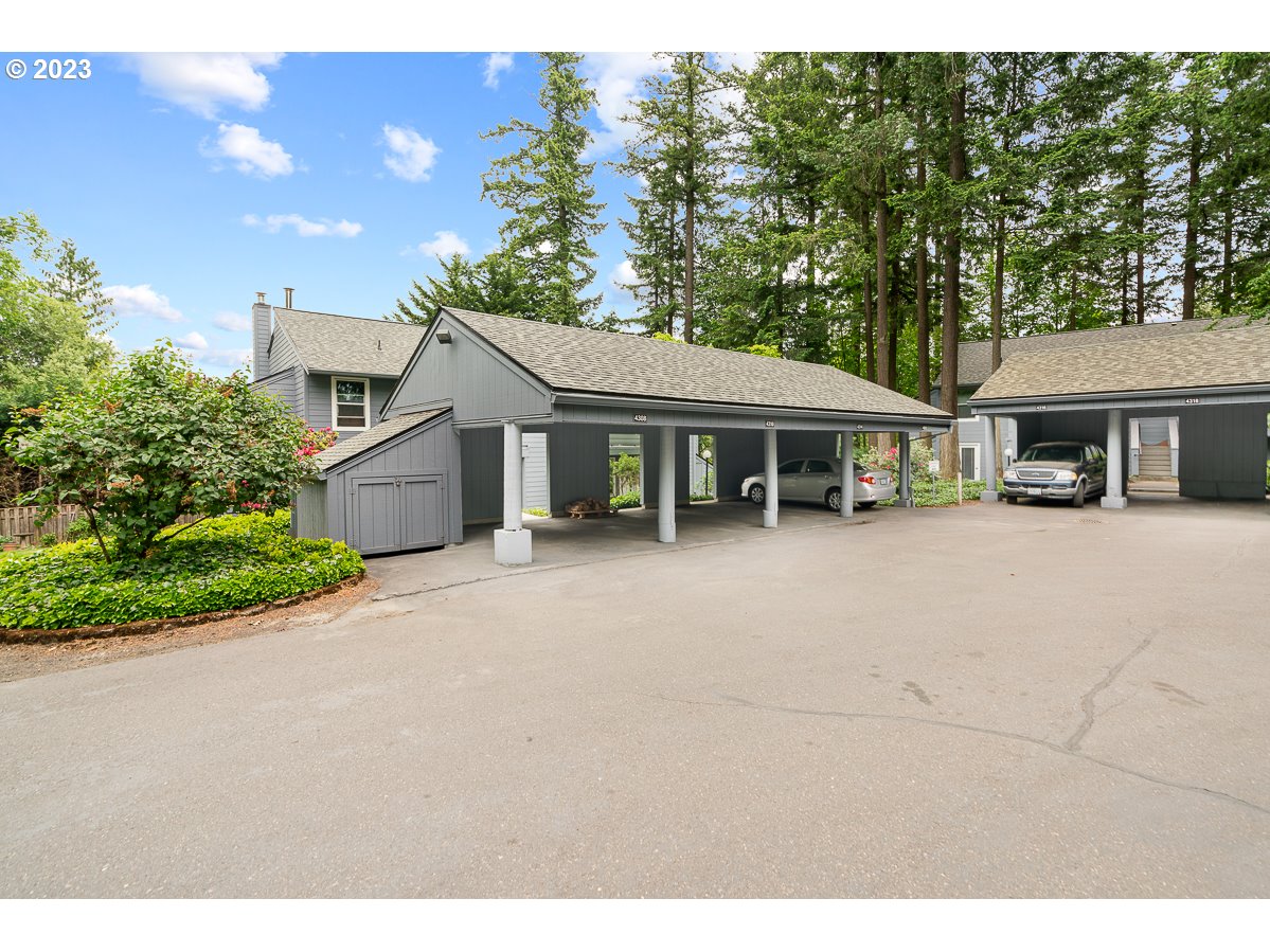 4308 Southwest Dickinson Street, Unit 15 Portland, OR 97219 - Photo 27 of 35 a house view with a garden space