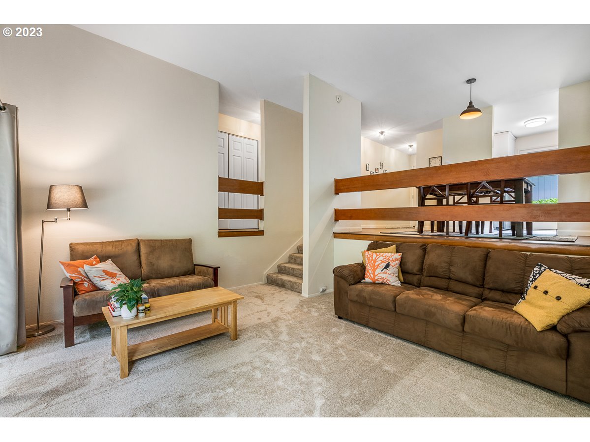 4308 Southwest Dickinson Street, Unit 15 Portland, OR 97219 - Photo 5 of 35 a living room with furniture and a couch