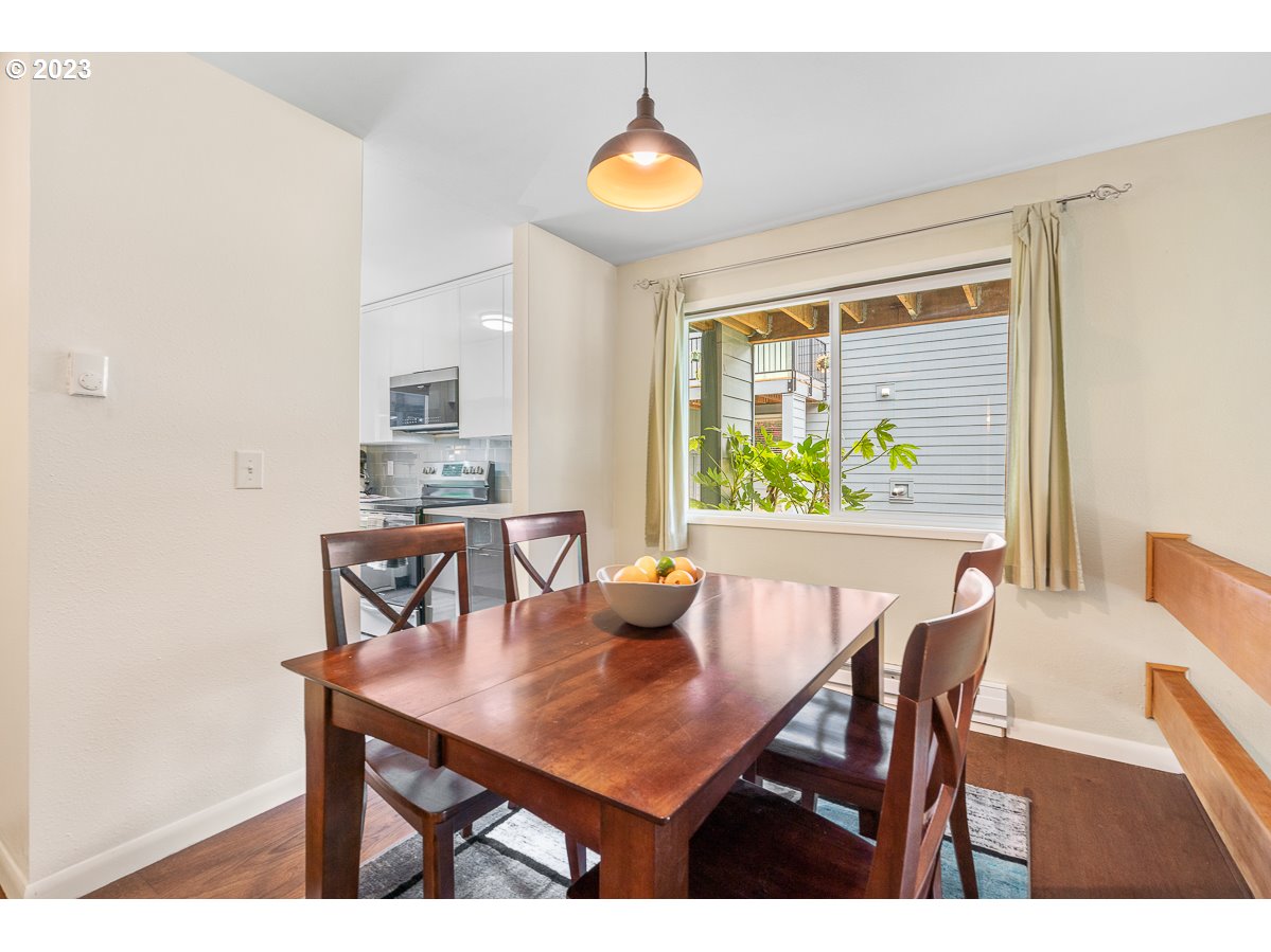 4308 Southwest Dickinson Street, Unit 15 Portland, OR 97219 - Photo 7 of 35 a view of a dining room with furniture and window