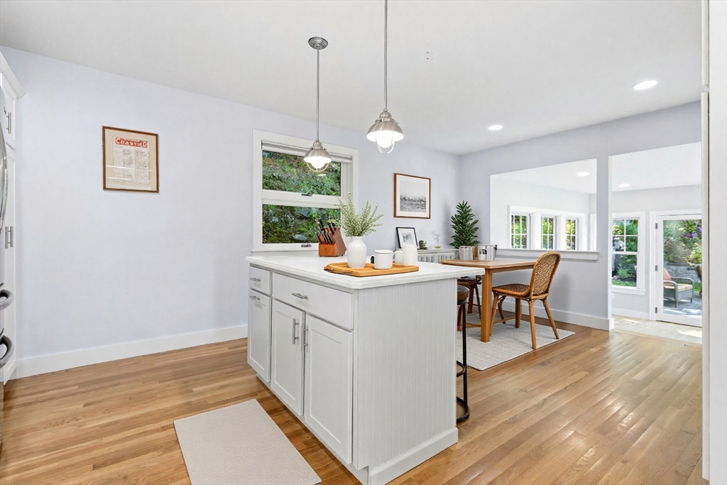 35 Keyes Road Westford, MA 01886 - Photo 13 of 40 a kitchen with stainless steel appliances kitchen island granite countertop a sink a counter space and a dining table
