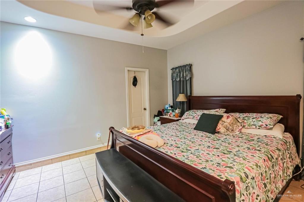 4701 Russell Circle Mission, TX 78574 - Photo 18 of 37 a bedroom with a bed and a dresser