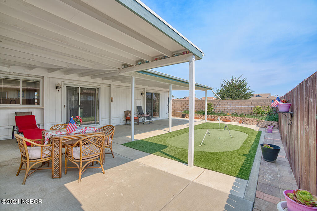919 Vista Del Rio Santa Maria, CA 93458 - Photo 13 of 29 a backyard of a house with outdoor seating