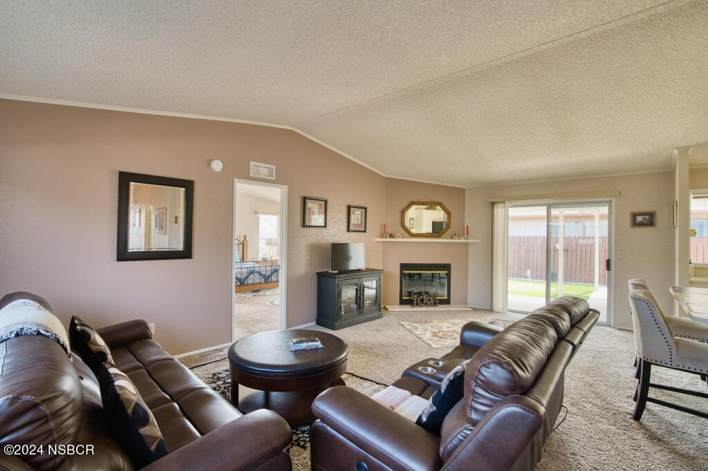 919 Vista Del Rio Santa Maria, CA 93458 - Photo 3 of 29 a living room with furniture and a fireplace