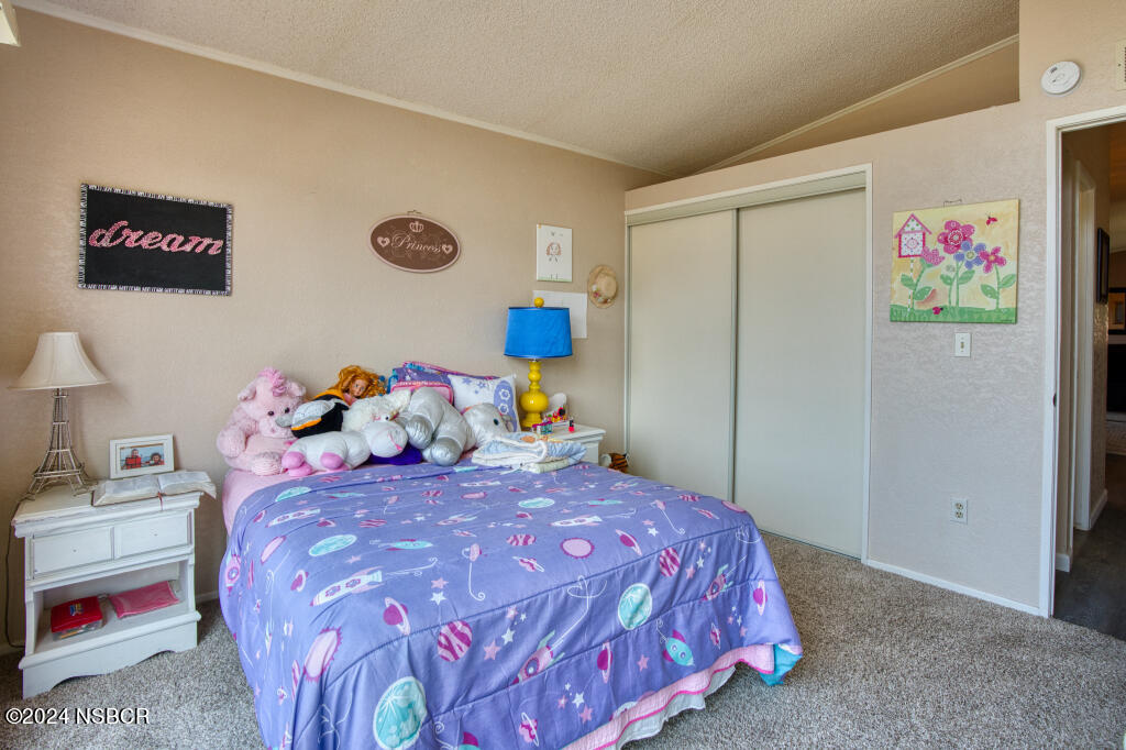 919 Vista Del Rio Santa Maria, CA 93458 - Photo 7 of 29 a bedroom with a bed and a dresser in it