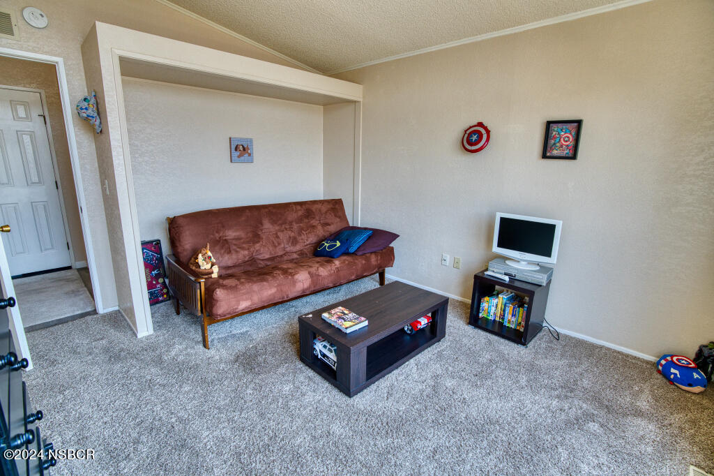 919 Vista Del Rio Santa Maria, CA 93458 - Photo 9 of 29 a living room with furniture and a couch