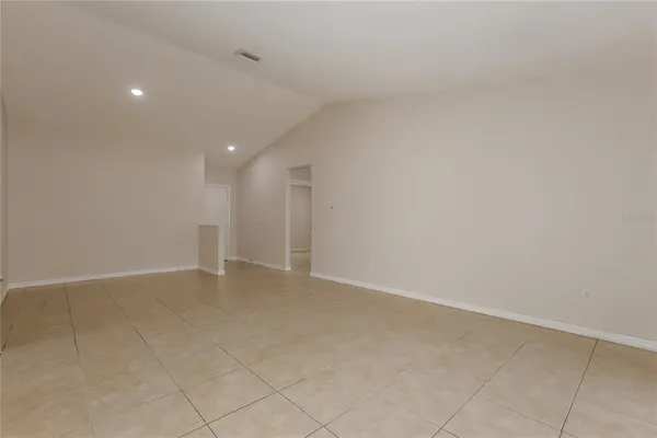 a kitchen with granite countertop stainless steel appliances a sink stove and microwave