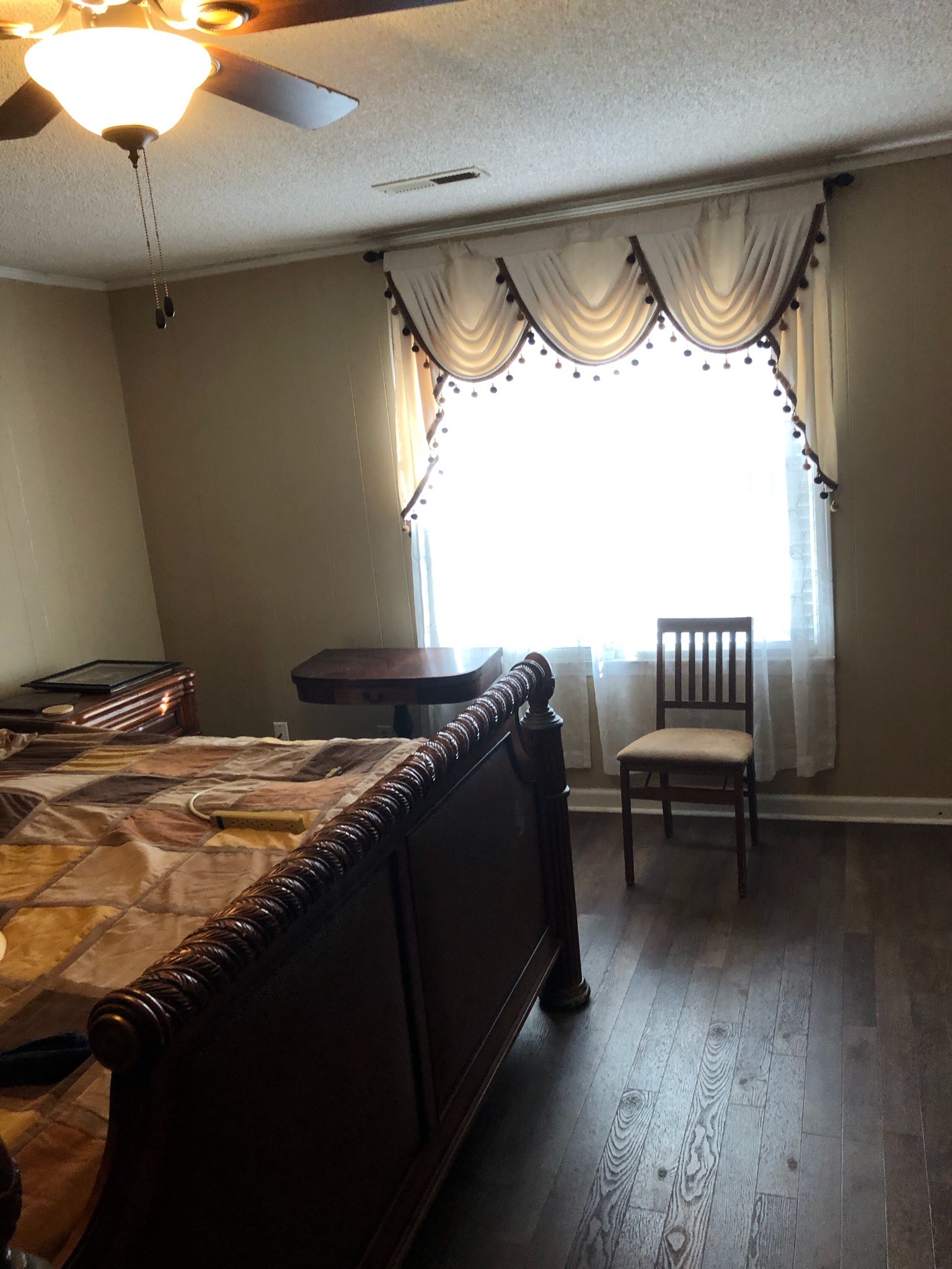 169 Scott Orchard Road Taft, TN 38488 - Photo 12 of 28 a bed sitting in a room next to a window