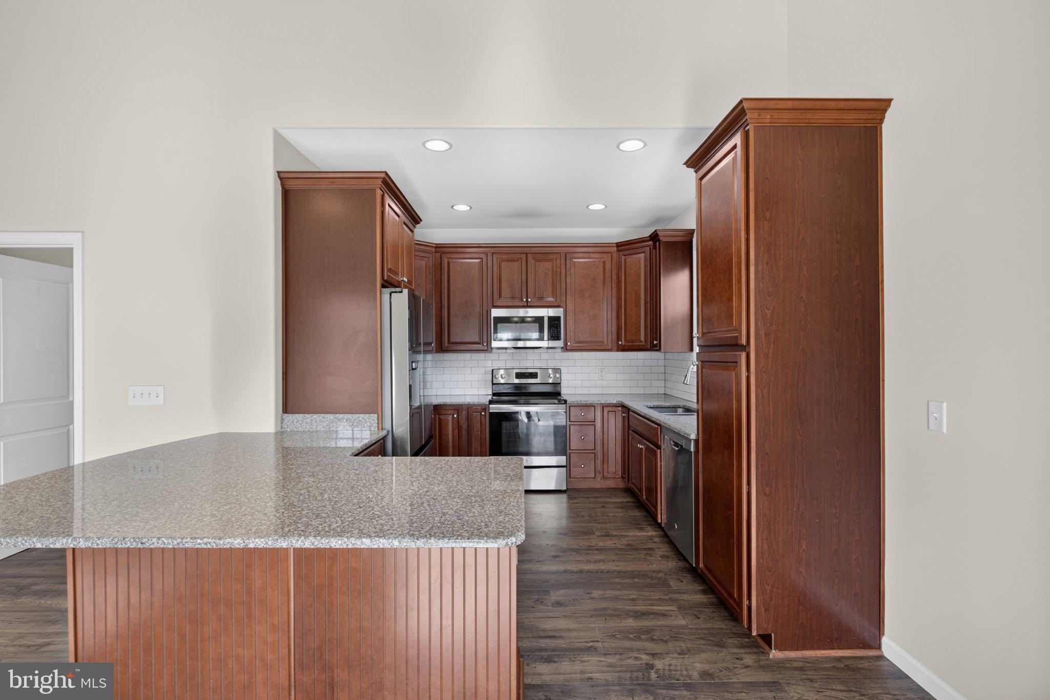 27 Sun Ridge Drive Felton, DE 19943 - Photo 23 of 61 Modern kitchen with rich wood tones.