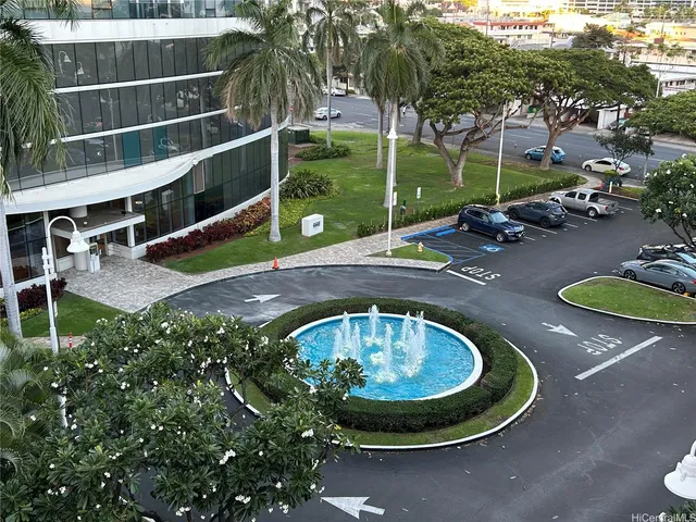 swimming pool view with a garden space and outdoor seating