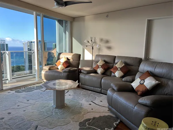 a living room with furniture and a window