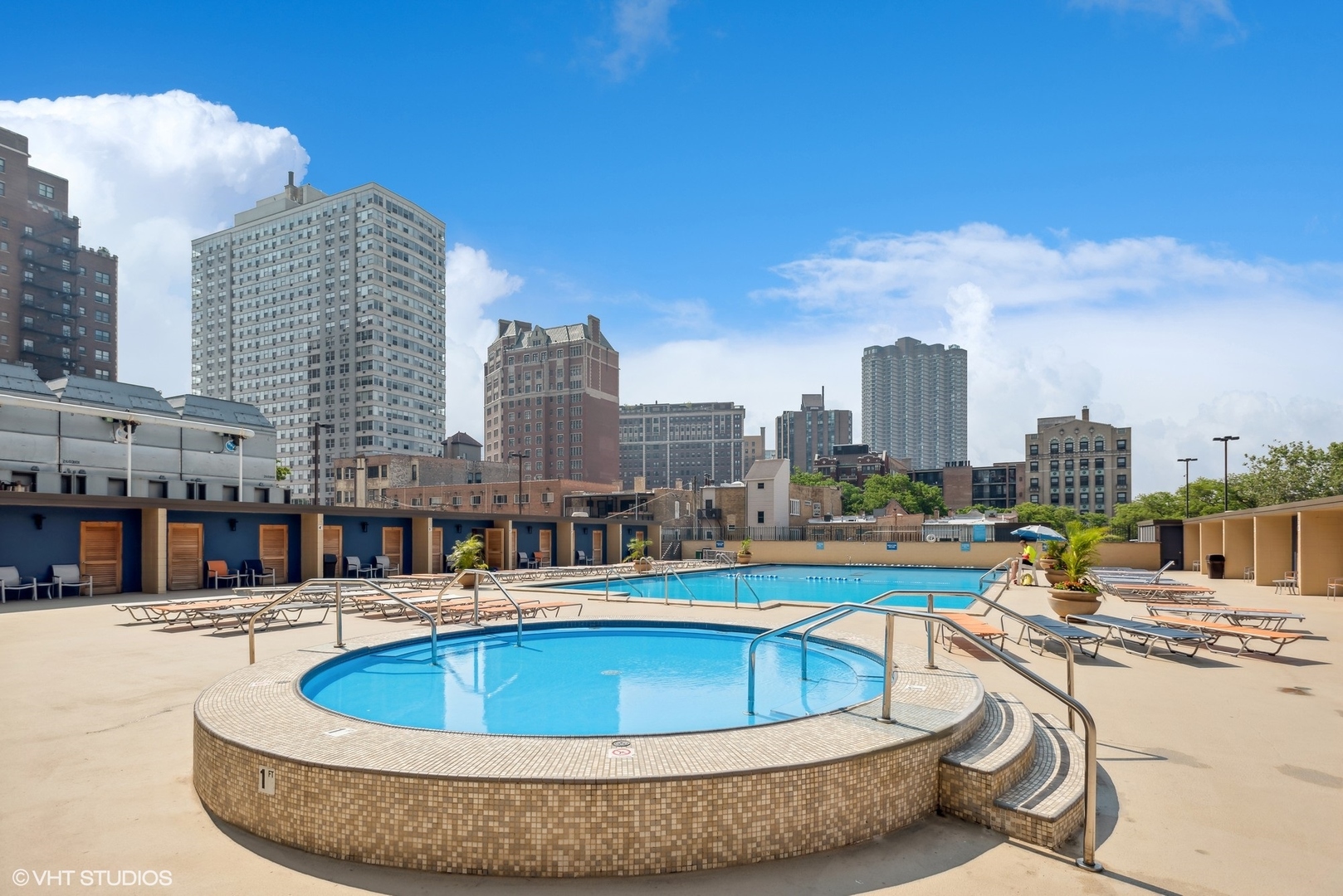655 West Irving Park Road, Unit 5507 Chicago, IL 60613 - Photo 13 of 17 a view of a swimming pool with a lawn chairs