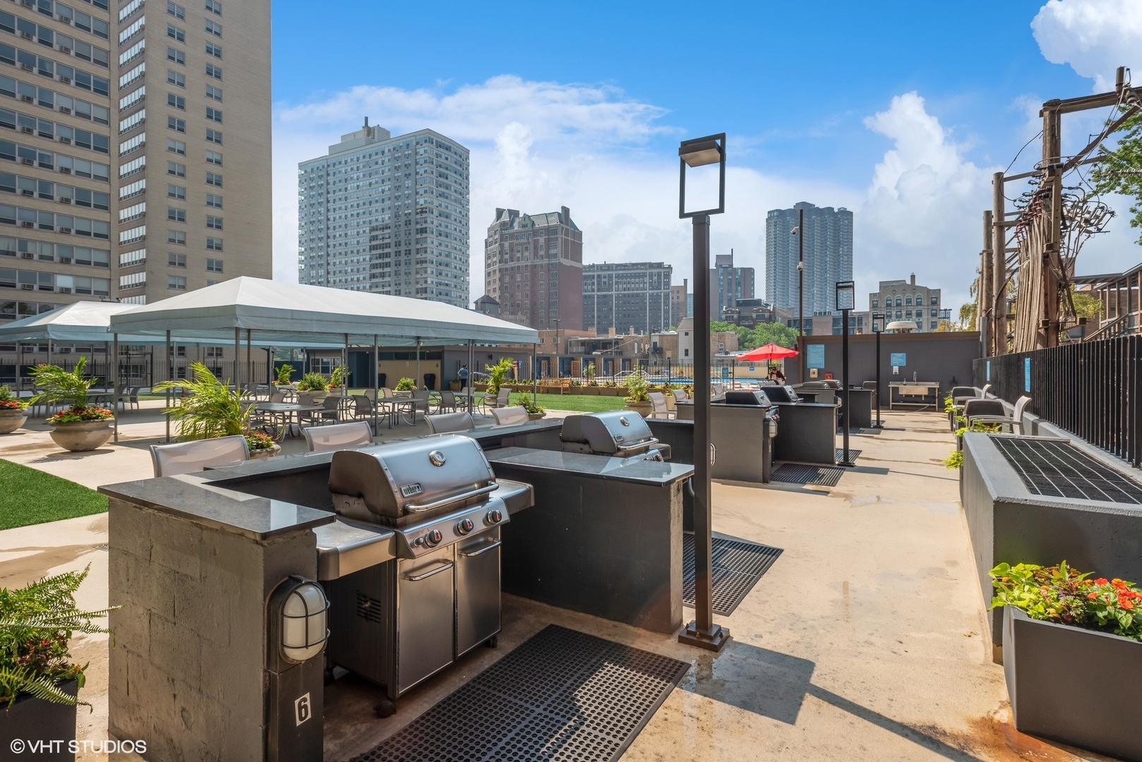 655 West Irving Park Road, Unit 5507 Chicago, IL 60613 - Photo 15 of 17 a patio with water view and city view