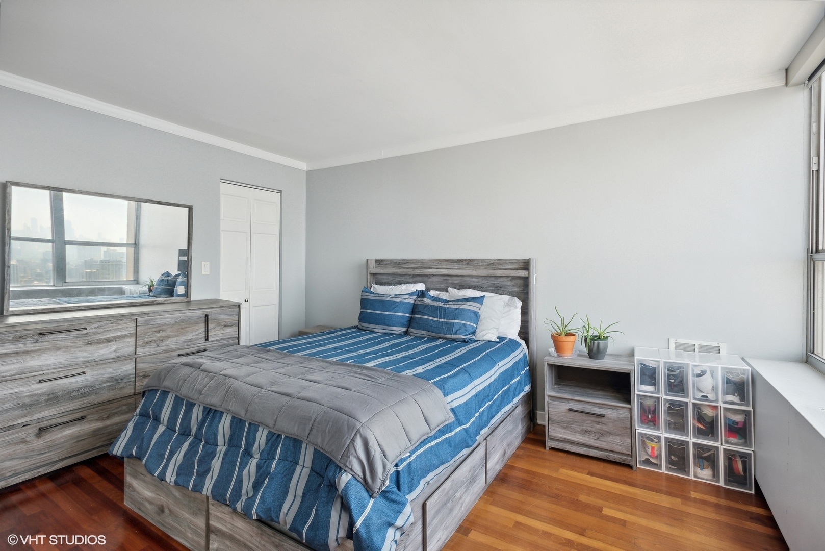 655 West Irving Park Road, Unit 5507 Chicago, IL 60613 - Photo 8 of 17 a bedroom with a bed and a view of bedroom