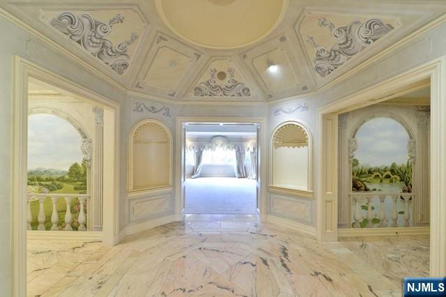 101 Fox Hedge Road Saddle River, NJ 07458 - Photo 13 of 21 a view of a entryway door with a chandelier