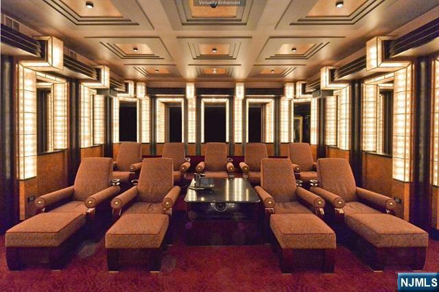 101 Fox Hedge Road Saddle River, NJ 07458 - Photo 18 of 21 a media room with lots of chairs and a projector