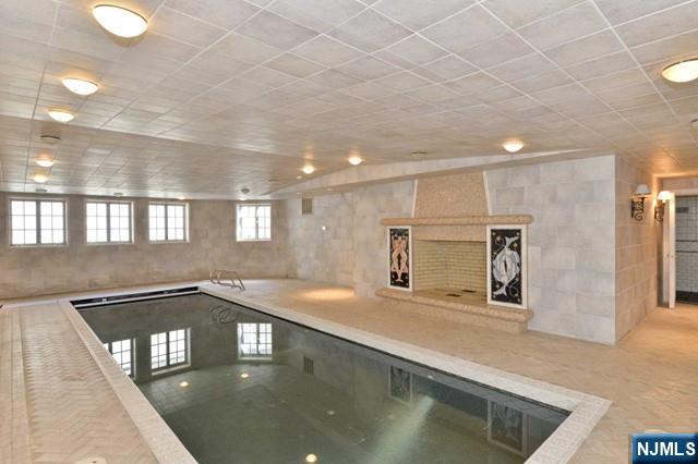101 Fox Hedge Road Saddle River, NJ 07458 - Photo 19 of 21 a kitchen with stainless steel appliances granite countertop a sink and a refrigerator