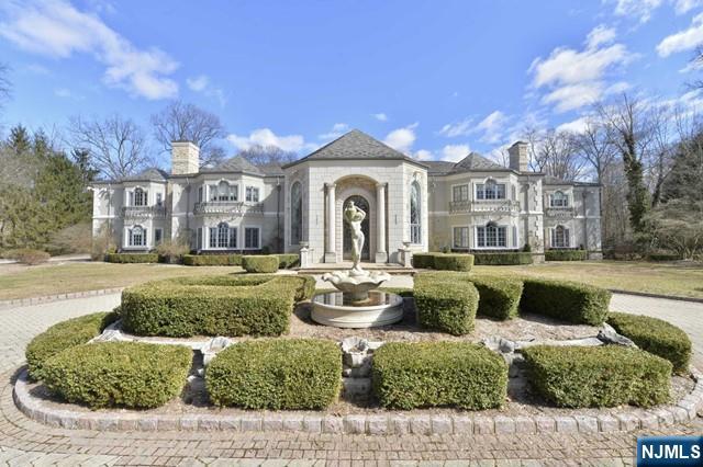 101 Fox Hedge Road Saddle River, NJ 07458 - Photo 21 of 21 a front view of a house with a garden