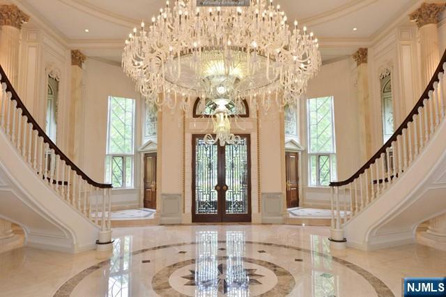 101 Fox Hedge Road Saddle River, NJ 07458 - Photo 5 of 21 a view of a hallway with wooden floor and staircase